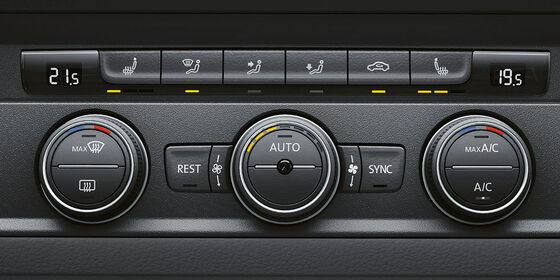 A ilustração mostra o sistema de ar condicionado "Climatronic" com práticos botões de controlo.